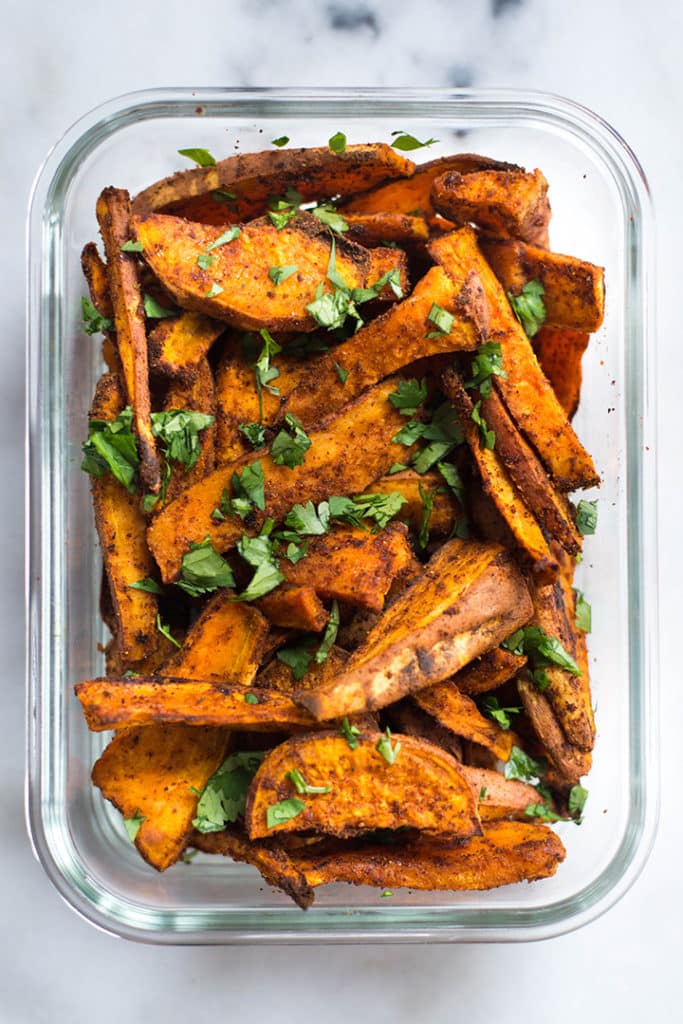 Meal prep container with spicy chile sweet potato fries.