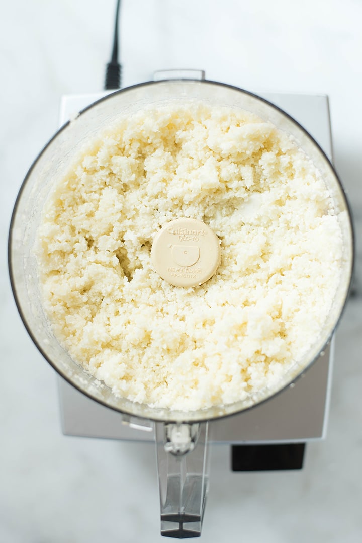 Freshly made riced cauliflower in the food processor.