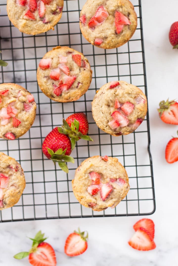 A closer view of the strawberry muffins cooling on the cooling rack.