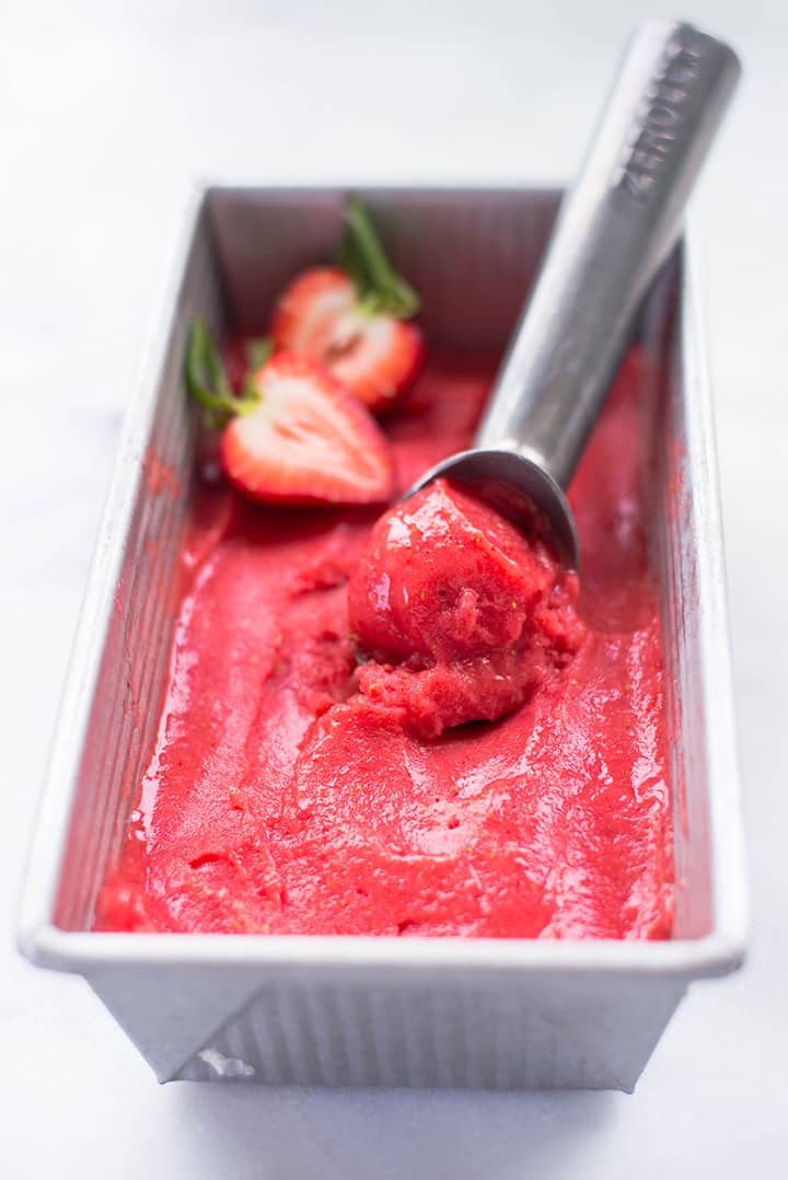Homemade healthy strawberry sorbet in a loaf pan. 