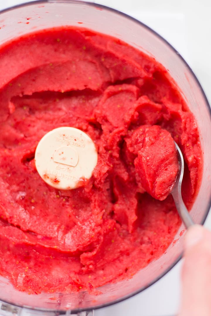 Close up of strawberry sorbet in the food processor.