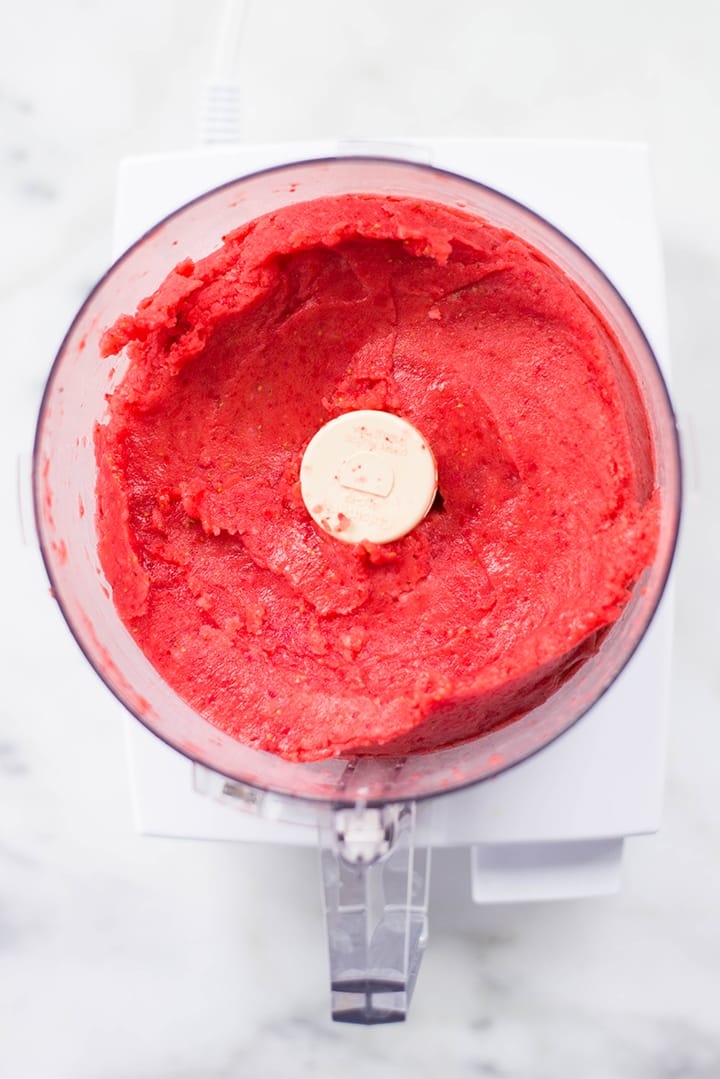 Freshly made strawberry sorbet in the food processor.