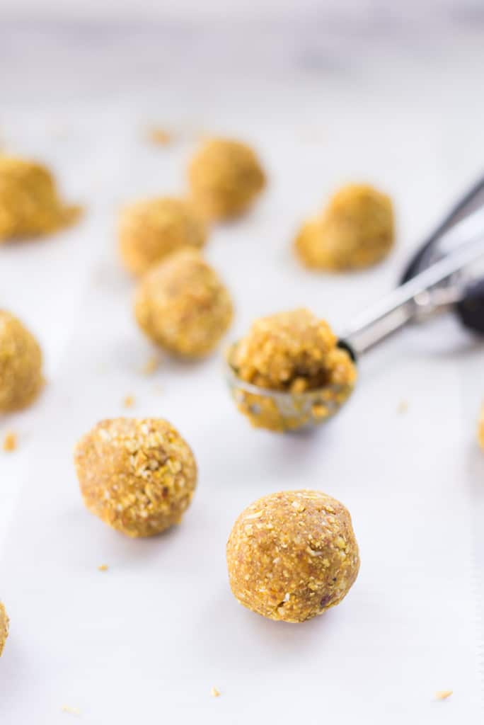 Close up of lemon turmeric and ginger energy balls which are the daily snack in this 5 day meal plan to reduce inflammation.