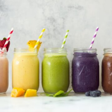 high protein fruit smoothies all lined up in a row