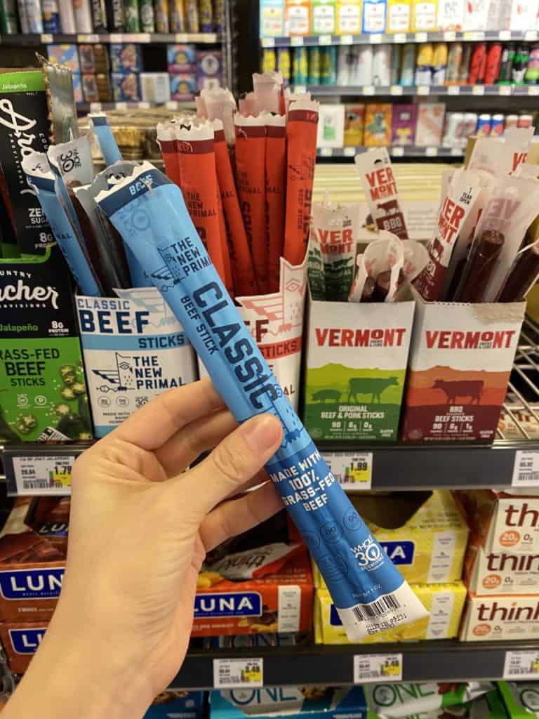 The New Primal Classic Beef Stick package being held in a store