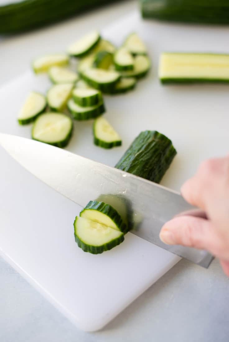 cutting cucumbers for the tomato salad